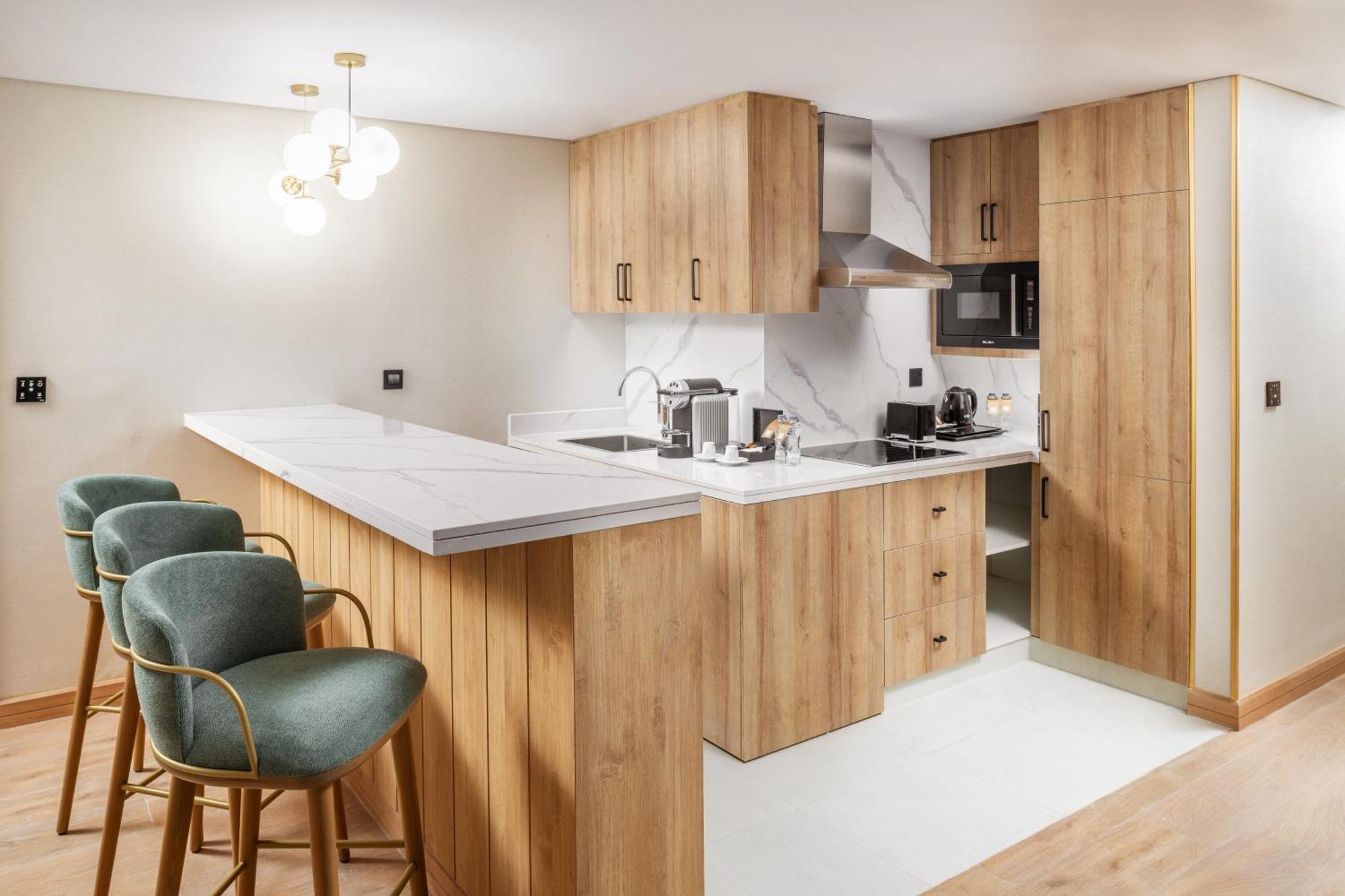 ไทบา อารัค สวีท Medina ภายนอก รูปภาพ A kitchen in a serviced apartment